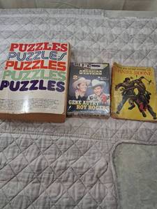 lot 30 image: Classic Book and Media Collection - Puzzle Book, Western DVD, Daniel Boone Story