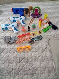 lot 84 image: Mixed Toy Lot with Water Guns, Novelty Glasses, and Action Figures