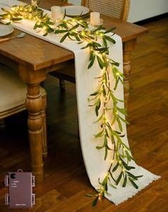 lot 2804 image: JMEXSUSS Artificial Olive Lighted Garland for Fireplace Decor, 100 LED 6 Ft Christmas Mantel Garland Fairy Lights Battery Operated, Vines with Lights for Table Bedroom Wedding Easter Spring Decoration