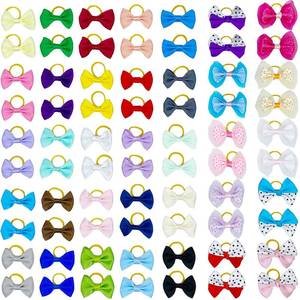 lot 3235 image: DORUI Dog Bows, Cute Hair Bowknot with Rubber Bands Handmade for Puppy Yorkie Grooming Hair Accessories & Varies Patterns Topknot Bows(70 pcs Upgrade Rubber Bands)