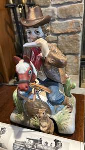 lot 40082 image: Cowboy Playing Harmonica Ceramic Figurine