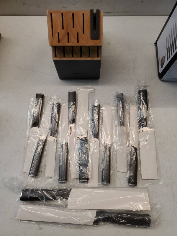 lot 26841 image: Kitchenaid 14 pc Cutlery Handcrafted Japanese Steel Comfortable Non-Slip Grip Building Knife Sharpener. Base is Damaged on the Side. - Retail $52