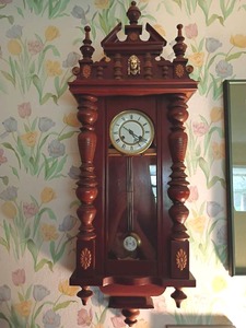 lot 931 image: Wooden Pendulum Wall Clock with Roman Numerals.   42 x 15 x 6