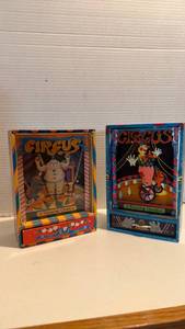 lot 1015 image: Circus clown dancing musical box (smaller one is overwound)