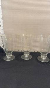 lot 1083 image: Etched Floral Glass Footed Goblets Set of 3 and Etched Glass Pitcher and Creamer Set