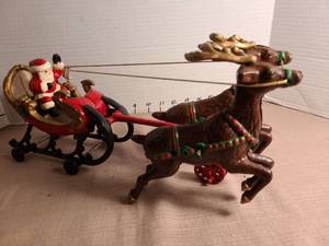 lot 1101 image: Vintage cast iron Santa and Reindeer Sleigh