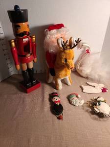 lot 1108 image: Nutcracker soldier, Santa on plush reindeer, ornaments