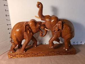 lot 1151 image: Hand Carved Wooden Elephant Figurine from Thailand, trunk has been glued on right elephant