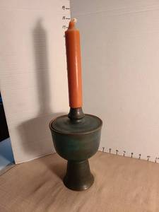 lot 1194 image: Green Glazed Ceramic Candleholder with Orange Candle