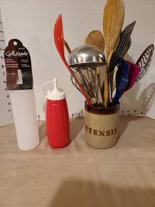 lot 1242 image: Kitchen utensils in holder and condiment dispensers.