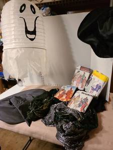 lot 1319 image: Halloween witch cape with hats and spider web scarves, hanging ghost lantern, costume patterns.