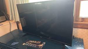 lot 1558 image: Toshiba Flat Screen TV with Universal Remote Control