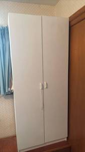 lot 1562 image: White Two-Door Wardrobe Cabinet with Shelving 71x30x17