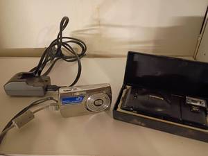 lot 1663 image: Olympus Cameras and Charger