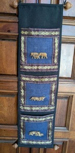 lot 3044 image: Handwoven Wall Hanging with Carved Elephant Motifs