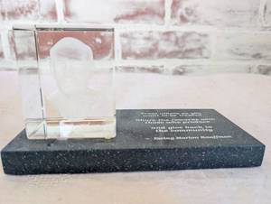 lot 6512 image: Crystal Desktop Award with Ewing Marion Kauffman Quote (Royals Kauffman Stadium namesake)
