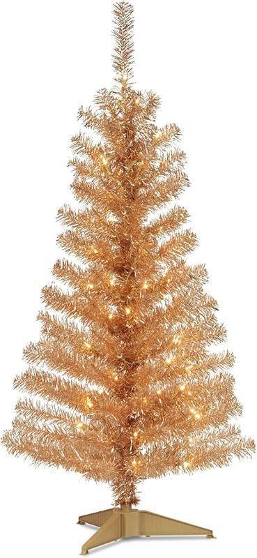 lot 271310 image: National Tree Company 4 ft Pre-Lit Champagne Gold Tinsel Mini Artificial Christmas Tree, 70 Clear Lights, 110 Tips, Includes Stand