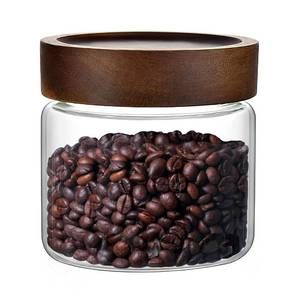 lot 48816 image: 17 Fl oz500 ml Glass Food Storage Jar, Premium Clear Glass Container Jar with Airtight Screw-on Wooden Lid, Kitchen Canisters for Coffee,Tea,Pasta,Cookies, Nuts,Spice,Candy,Overnight Oatmeal (Small) - Retail $13