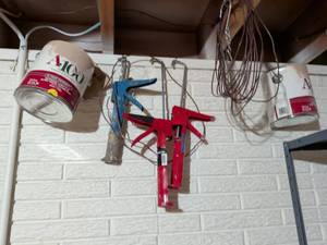 lot 123 image: Three Caulking guns wire to empty paint buckets