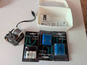 lot 351 image: RadioShack Cordless Phone Battery Collection with Charger and Storage Box