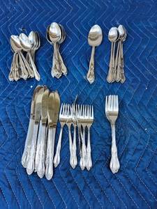 lot 102 image: Silver Plated Flatware Set with Ornate Pattern - Retail $45