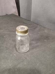 lot 4640 image: Glass SaltPepper Shaker  with Metal Lid