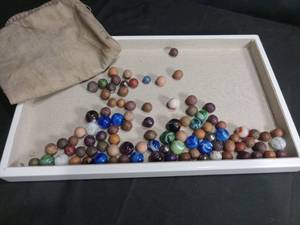 lot 4557 image: Mixed Glass and Clay Marble Collection with Storage Pouch