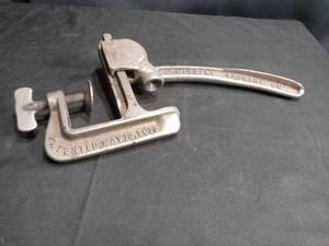 lot 4569 image: Wolpert Grocery Co Cast Iron Can Opener Patent 1913