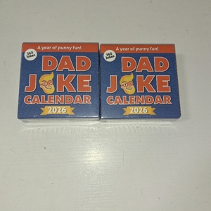 lot 3514 image: LOT OF TWO - Dad Joke Calendar 2026  Page A Day Tear Off Calendar Gift For The Dad Joke Lover, Great Christmas Gift, Funny Daily Dad Jokes Desk Calendar, Stocking Stuffer Gift For Men &amp Women, 365 New Jokes &amp Puns for The New Year