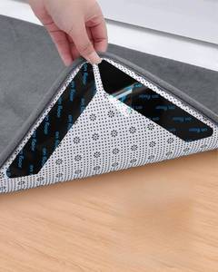 lot 4362 image: 32 PCS Reusable Washable Grippers for Rugs, Highly adhesive and thin��Removable Rug Tape,Double Sided Non-Slip Rug Pads for Hardwood Floors and Carpet Corners,Keep Area Rugs Corners from Curling .