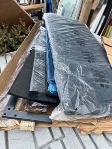 lot 28 image: Quality Twin Bed Frame - Cool Features like Shelf Headboard with Charger Outlet - Black - Missing Shelves bottoms, but does not affect structural integrity- See images