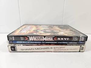 lot 317 image: WWE DVD Collection - WrestleMania XXVI, Best of SmackDown 10th Anniversary, Shawn Michaels Story