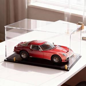 lot 29408 image: Acrylic Display Case for Collectibles, Dustproof Acrylic Box with Clear Display Elevation & Gold Risers, Large Display Case for Figures Toys Memorabilia, 13 L x 6.7 W x 7.5 H - Retail $30