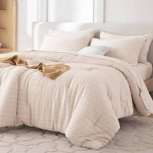 lot 62620 image: MUXHOMO 7 Pieces Queen Comforter Set, Seersucker Bed in a Bag Queen Size, All Season Luxury Bedding Set with Comforter, Flat Sheet, Fitted Sheet, Pillowcases & Shams, Beige - Retail $36