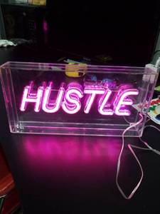 lot 4767 image: HUSTLE Pink LED Neon Light Sign with Clear Acrylic Case
