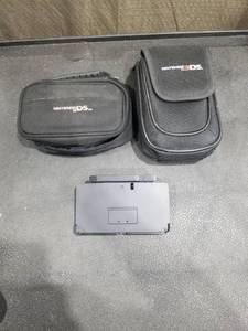 lot 4839 image: Nintendo 3DS Console with Charging Dock and Carrying Cases