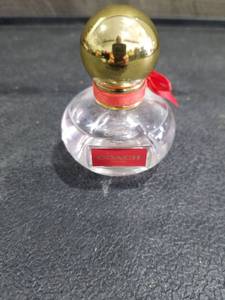 lot 4862 image: Coach Womens Perfume Bottle with Gold Cap and Red Ribbon