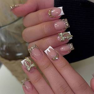 lot 4395 image: 24Pcs Press On Nails Short Square Fake Nails Gold French Tip False Nails With Gold Bow Designs Artificial Acrylic Nail Press Ons Full Cover Glue On Nail Glossy Stick On Nails For Women