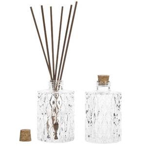 lot 16326 image: MyGift Small Clear Glass Reed Diffuser Bottles, Vintage Embossed Apothecary Style Flower Bud Vases with Cork Lids, Set of 2