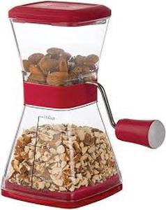 lot 4460 image: Red Manual Food Nut Chopper. Has been used.