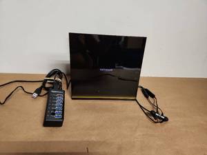 lot 21 image: Netgear Wireless Router with AmazonBasics USB Hub and Wireless Earbuds Bundle