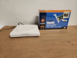 lot 35 image: Linksys Gigabit Network Adapter EG1032 with White Wireless Router