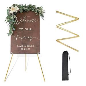 lot 653 image: DANMO Easel Stand for Wedding Sign Poster 63 Instant Display Floor Adjustable Metal Art Easel Gold - Retail $22