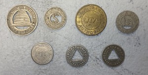lot 62 image: Collection of 7 Transit Tokens from Various Transportation Systems
