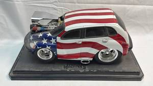 lot 73 image: PT Cruiser American Flag Patriotic Die Cast Model Car