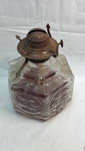 lot 76 image: Glass Oil Lamp with Embossed Design and Metal Burner filled w Red Marbles