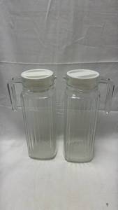 lot 159 image: Glass Pitchers with White Lids Set of 2