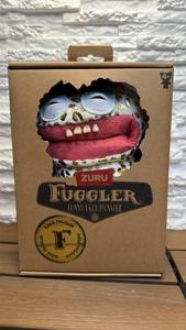lot 228 image: Fuggler ZURU Funny Ugly Monster Plush Toy with Gold Spots and Red Lips (Unopened)
