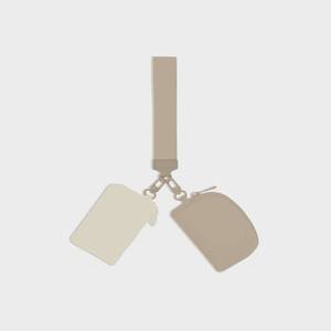 lot 145 image: Grayson Smile Dual Pouch Wristlet Beige - Retail $10