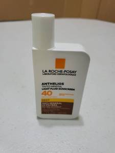 lot 56913 image: La Roche-Posay Anthelios Tinted Mineral Light Fluid Sunscreen SPF 40 1.7oz - Retail $25